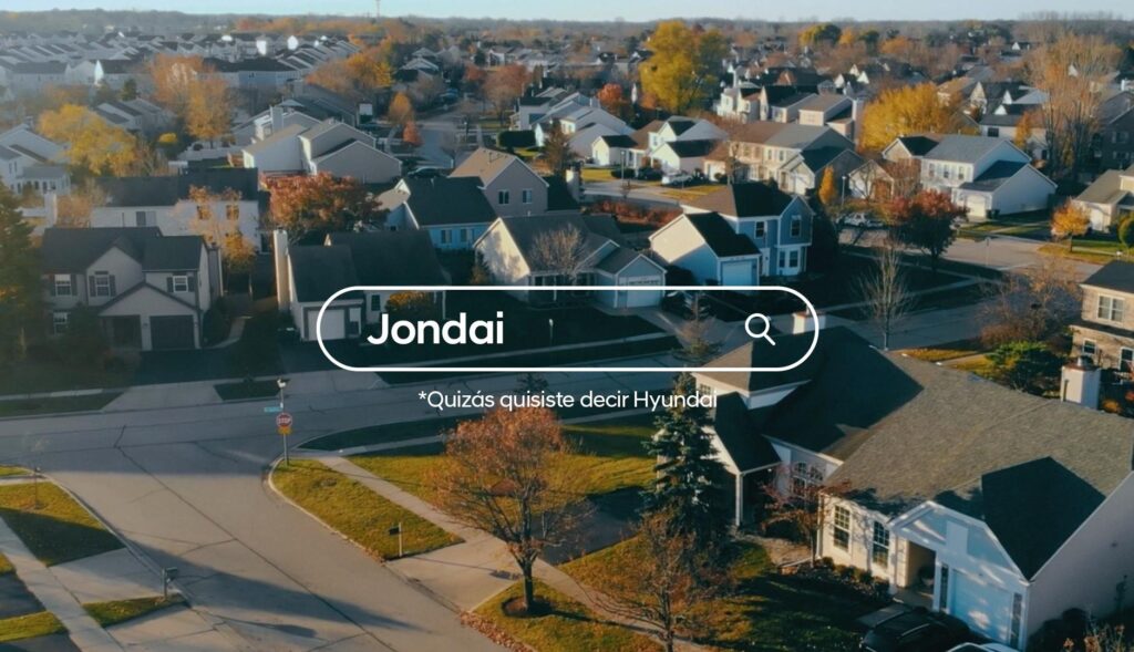 Barra de búsqueda con el término "Jondai" sobre un plano de un vecindario con casas unifamiliares