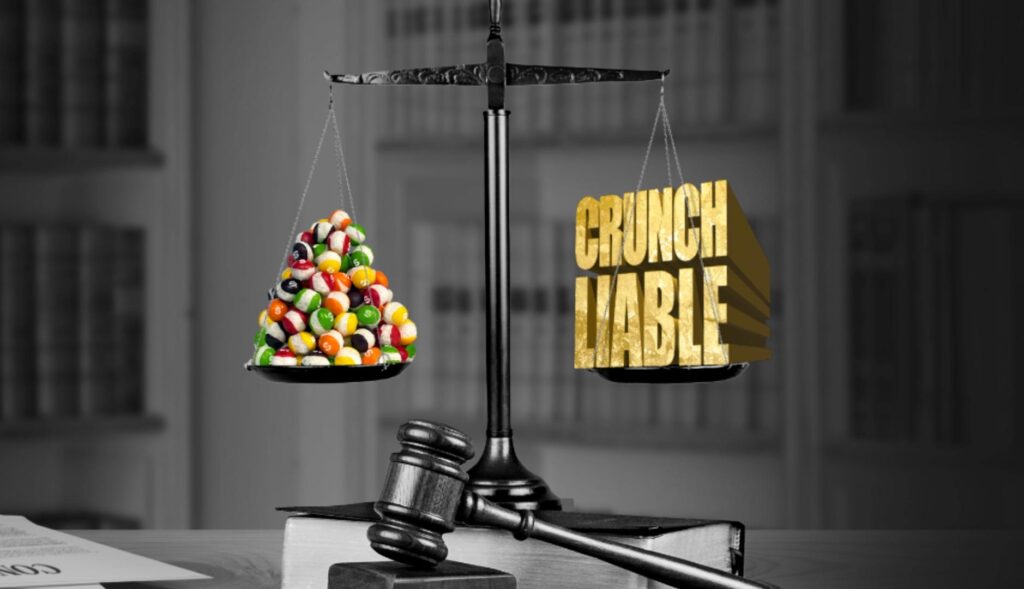 Una balanza con caramelos Skittles a un lado y la palabra "crujientes" al otro