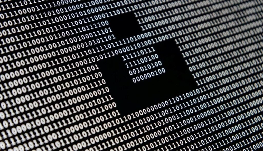 Un fondo negro con ceros y unos blancos a modo de código