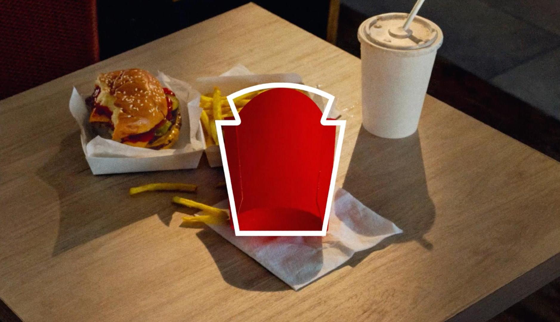 Silueta del logotipo de Heinz sobre caja de patatas fritas